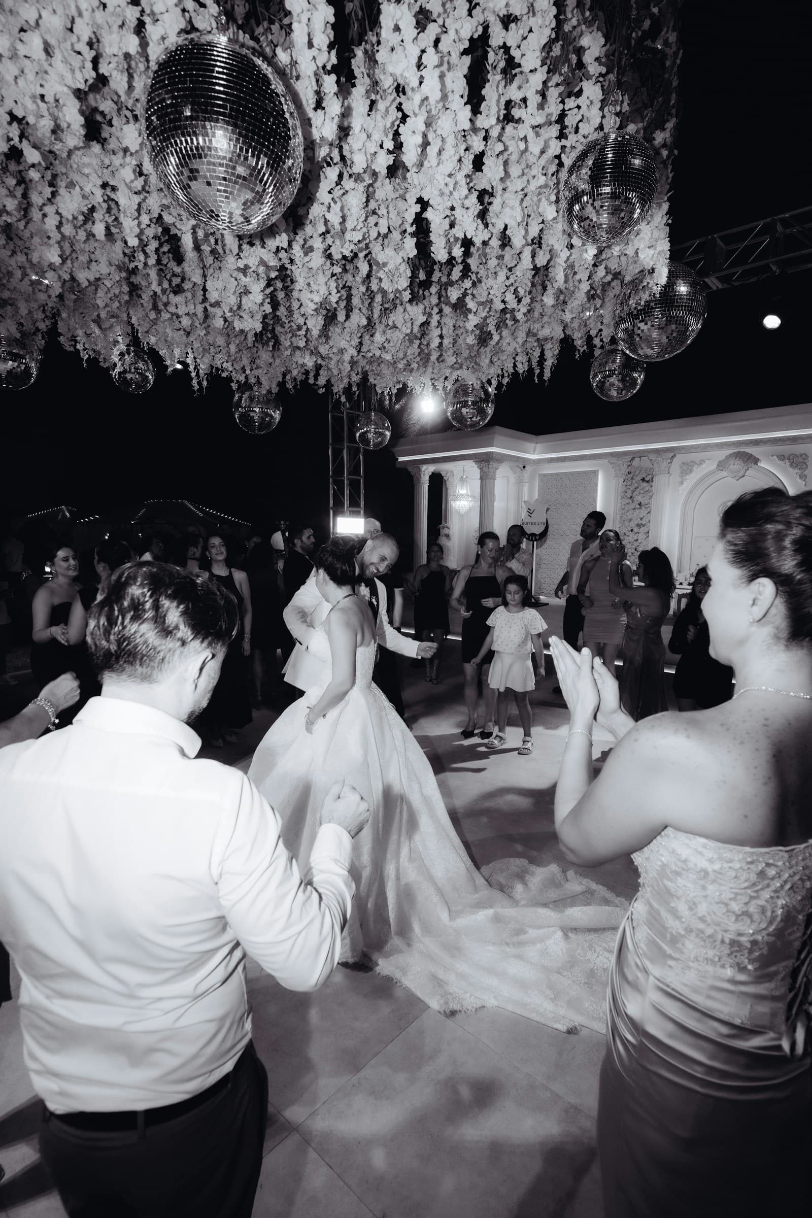 Wedding guests surrounding a couple on the dance floor